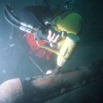 underwater impact wrench to tighten bolts on installed split pipe used to protect cable on the ocean floor.